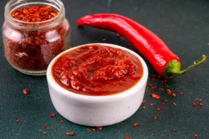 Dnešní den patří pálivým omáčkám: Tu nejostřejší na světě vytvořil šlechtitel chilli Ed Currie